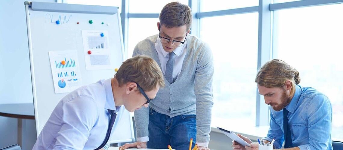 A team of professionals collaborating in an office to deliver high-quality outcomes.