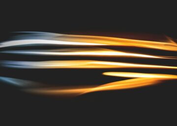 A light streaks on a black background.